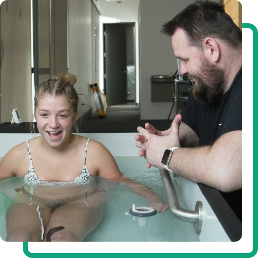 therapist talking to woman in cold plunge therapy tub in centerville utah